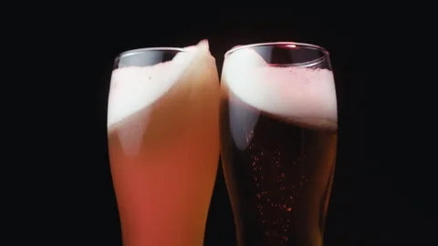 Slow Motion Shot of Beer Glasses Cheering in Bar Stock Footage 309870117