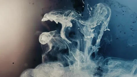 Slow motion shot of black and blue paint ink exploding blast Stockbeeldmateriaal 221977848