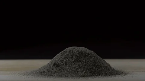 Slow motion shot of black pepper peppercorns falling in to black pepper heap Stock Footage 107003295