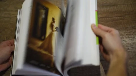 Slow motion shot of a book as it is turned Video stock 229627163