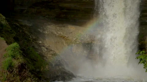 Slow-Motion shot of the bottom of Minnehaha Falls as the mist creates a rainbow Stock Footage