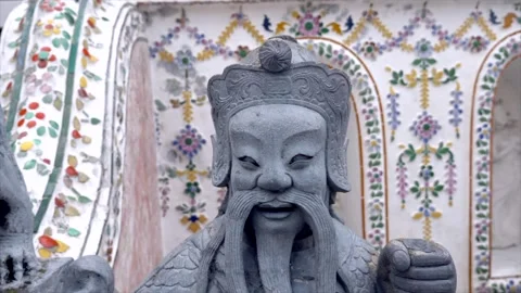 Slow motion shot bottom up of a statue at Wat Pho Stock Footage 292756686
