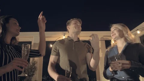 Slow motion shot bottom view company of positive beautiful young people Stock Footage 116646512