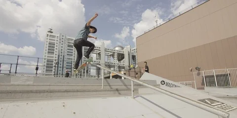 Slow motion shot of boy doing tricks on skateboard and falling down, Tokyo Stock Footage 136113991