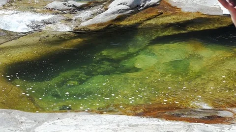 Slow motion shot of boy having fun sliding into the water Video stock 114178193