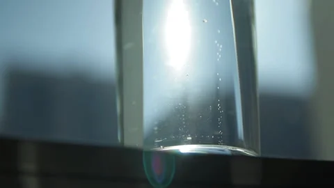 Slow motion shot of bubbles of sparkling mineral water in the glass. Extreme Stock Footage 89155309