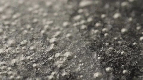 Slow motion shot of bubbles in thick boiling liquid. Stock Footage 132993737