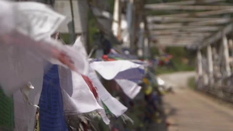 Slow motion shot of Buddhist Prayer Flag blowing in the wind in Arunachal Stock Footage 261038610