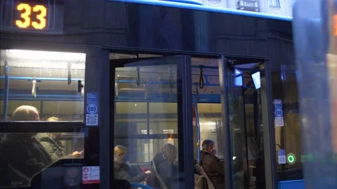 Slow motion shot of bus closing window in dawn, whilst passangers sitting Vídeo Stock 201421984