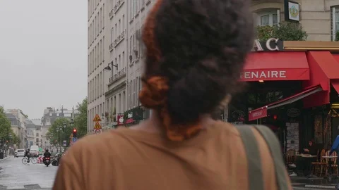 Slow motion shot of cafe in Paris and people crossing the street. Video stock 115443583