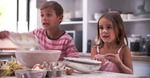 Slow Motion Shot Of Children Having Messy Fun In Kitchen Stock Footage 51275129