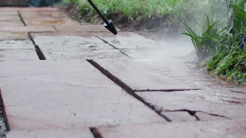Slow motion shot of cleaning old vintage flagstones. High pressure water Vídeos de archivo 242070566