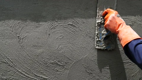 Slow-motion shot of close-up construction hand workers plastering cement duri Vídeo Stock 205541650