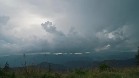 Slow motion shot of clouds running across the white sky over an amazing Stock Footage 271090675