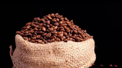 Slow motion shot of coffee beans on the sack. Video stock 122057545