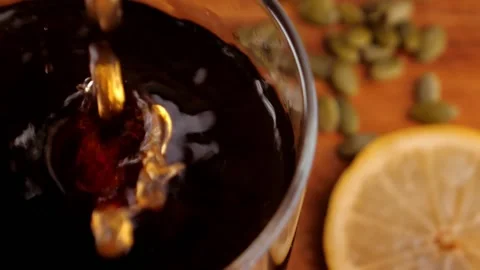 Slow-motion shot of coffee drops falling into a glass. Beautiful preparation of Stock-Footage 137855652
