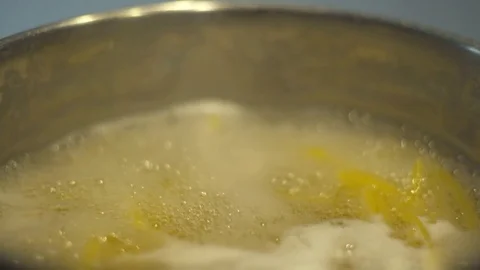 Slow motion shot of cooking spaghetti in a pot Stock Footage 84768628