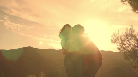 Slow motion shot of couple dancing and twirling overlooking mountain. Stock Footage 43667413