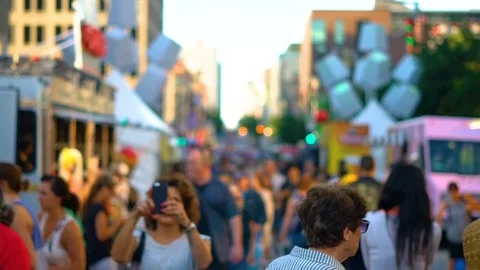 Slow motion shot of a crowd walking in the streets of Montreal Stock Footage 77970993