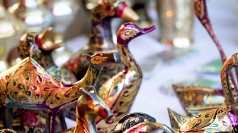 Slow motion shot of cultural handmade copper ornaments in Pakistan Stock Footage 252118694