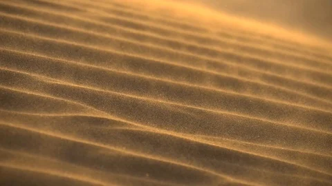 Slow motion shot of Desert sand dunes ripples in the wind Stock Footage