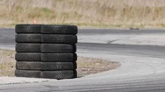 Aerial top view professional driver drifting car on asphalt road track with  white smoke, Automobile race car drift on abstract asphalt road with black  tire skid mark, View from above. Stock Photo