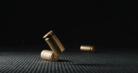Bullet Shells Falling Stock Footage ~ Royalty Free Stock Videos