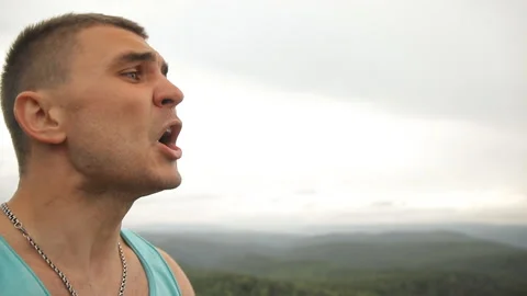 Slow motion shot of an evil man swears and screams. Stock Footage 91045063