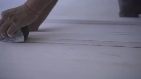 Slow Motion Shot Of Expert Worker Sanding Edges Of White Door Stock Footage 237494147