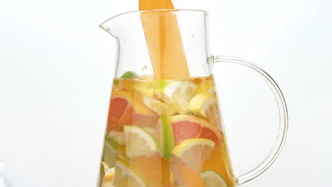 Slow motion shot of falling citrus fruits into water Stock Footage 140247417