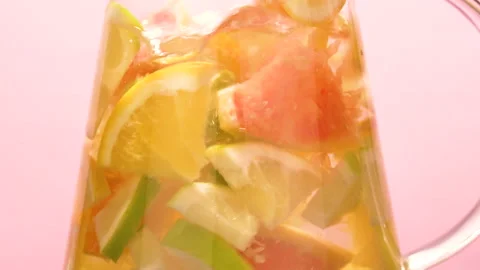 Slow motion shot of falling citrus fruits into water Stock Footage 140247975