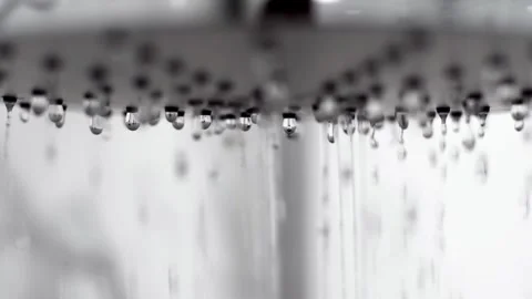 Slow motion shot of falling water and shower head. Stock Footage 268734956