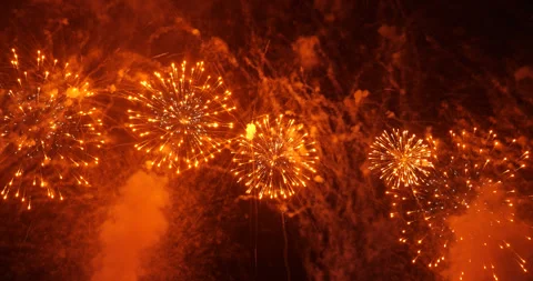 Slow motion shot of fireworks exploding in night sky, red aerial shells Stock Footage 326377172