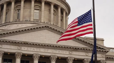 A slow motion shot of flags at the Utah State Capitol Building Stock Footage 60411887