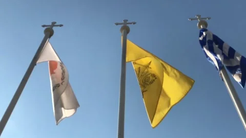 Slow Motion Shot of Flags Waving Against Blue Sky Stock Footage 101228077