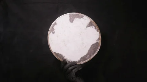 Slow motion shot of flour sifting against black background, closeup Stock Footage 108685587
