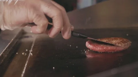Slow motion shot of frying cutlet for burger on electric commercial grill. Stock Footage 80676140