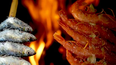 SLOW MOTION shot of grilling fish on the barbecue mesh grill. Stock Footage 135270949