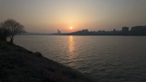 Slow motion shot of Han river with sunset view from Hangang park in Seoul, So Stock Footage 292807021