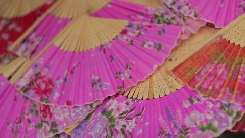 A Slow motion shot of Hand Folding fans at an Indian Wedding Stock Footage 203150442