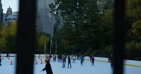 Slow Motion Shot Of Ice Skaters Skating On New York Ice Rink  Stock Footage 112597489