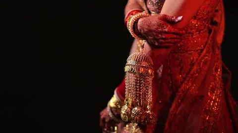 A slow Motion shot of an Indian Bride wearing her wedding jewellery Stock Footage 277187775
