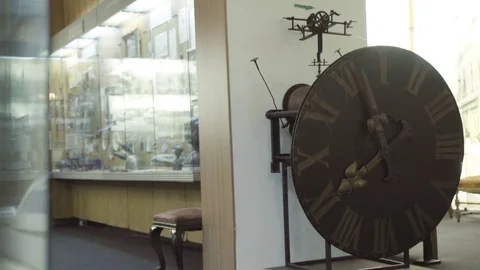 Slow motion shot inside a history museum with an old broken tower clock Stock Footage 123901250
