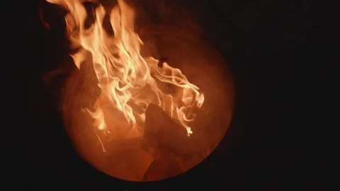 Slow motion shot of joss paper money being burnt Stock Footage 88850829