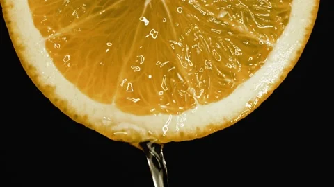 Slow Motion Shot a juice drops falls from an orange. Stock Footage 140519097