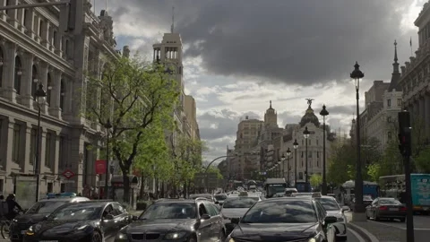 SLOW MOTION SHOT OF LA GRAN VIA STREET IN PARIS WITH CARS AND PEDESTRIANS Stock Footage 310361394