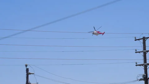Slow motion shot of LAFD responding to wildfire with aerial unit Stock Footage 335972472