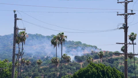 Slow motion shot of LAFD responding to wildfire with aerial unit Stock Footage 335972998