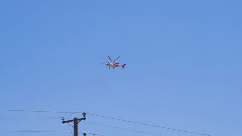 Slow motion shot of LAFD responding to wildfire with aerial unit Stock Footage 335975430