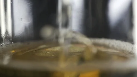 Slow Motion shot of a Larger style beer being poured into a glass Stock Footage 86081346